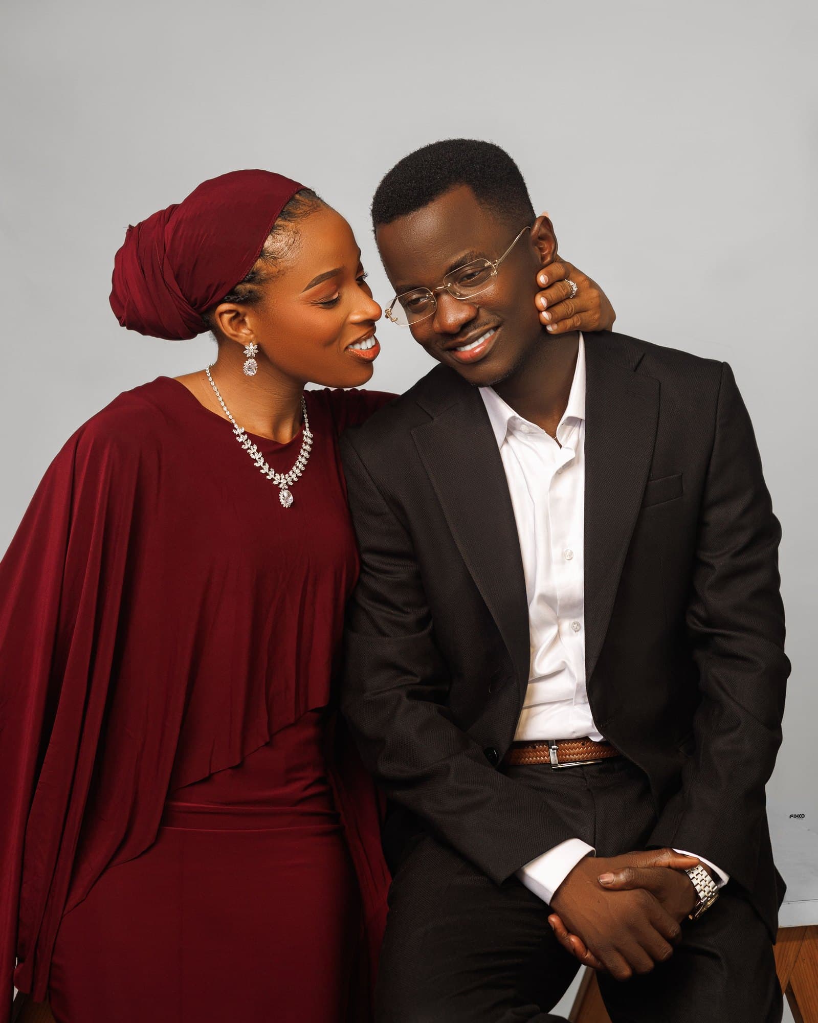 Black and white portrait of Scholarstica with her hand tenderly on Joseph's cheek